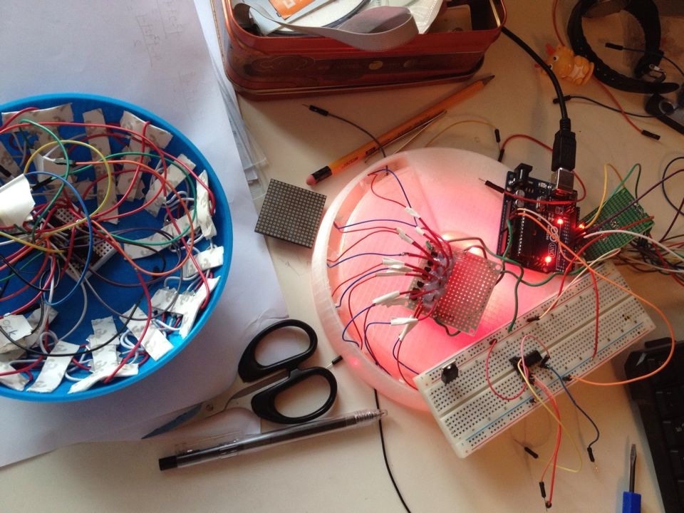 A view of inner components of my custom instrument where taped cables and an Arduino controller could be seen
