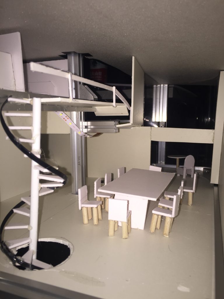 Interior view of our house model showing staircases, table and chairs